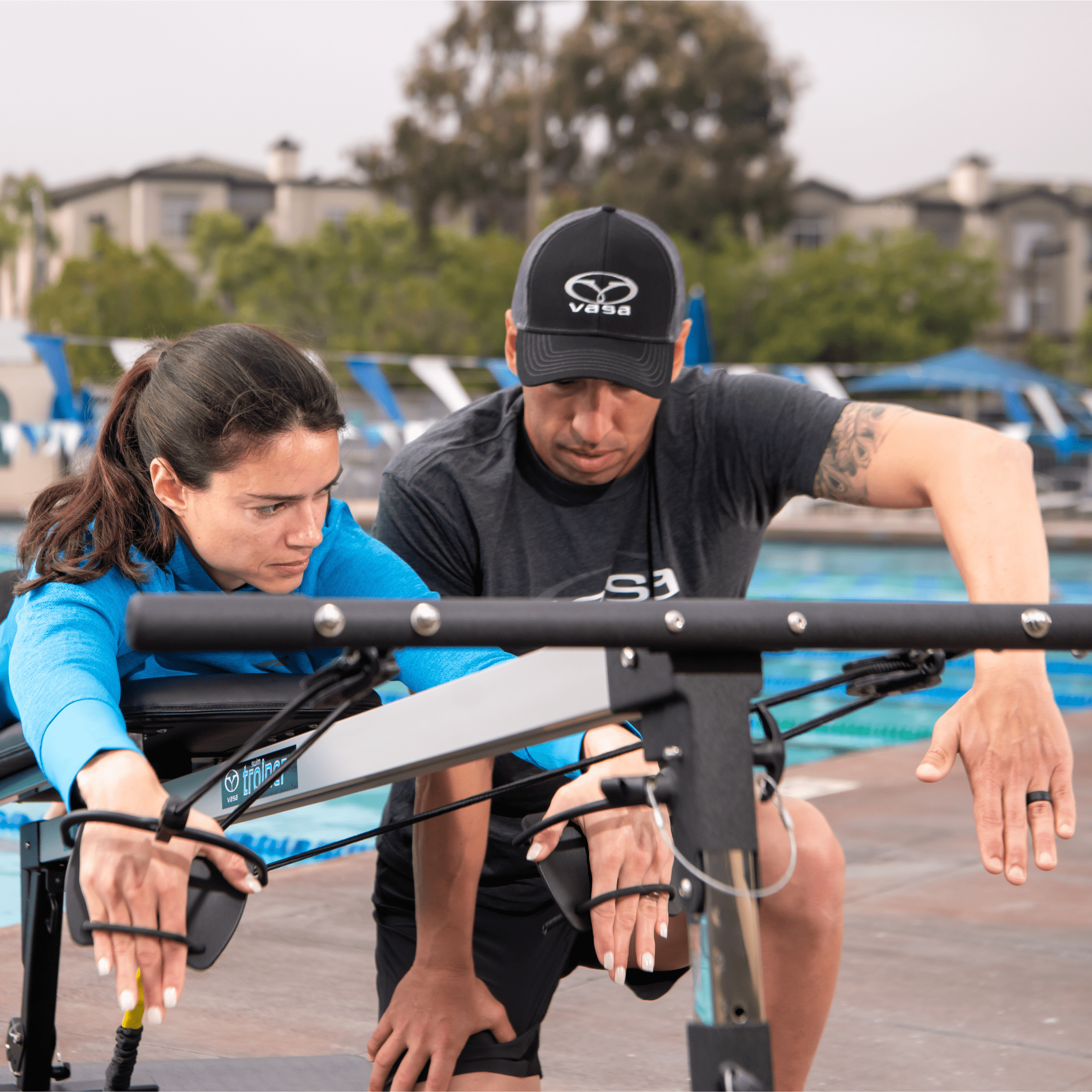Lady training with aids like kickboards, pull buoys, and swim cords from Vasa