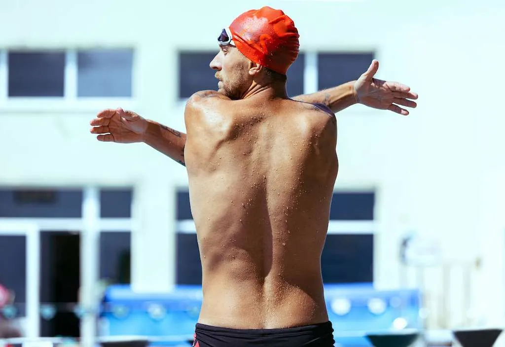 Back View Of Young Muscular Man, Swimmer Training Alone At Public Swimming-pool, Outdoors. Sport, Po